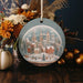 a christmas ornament hanging from a wooden table