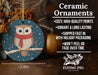 a ceramic ornament with an owl wearing a scarf