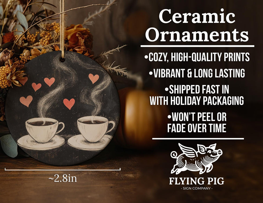a ceramic ornament with two cups of coffee