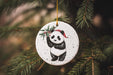a ceramic ornament hanging from a christmas tree