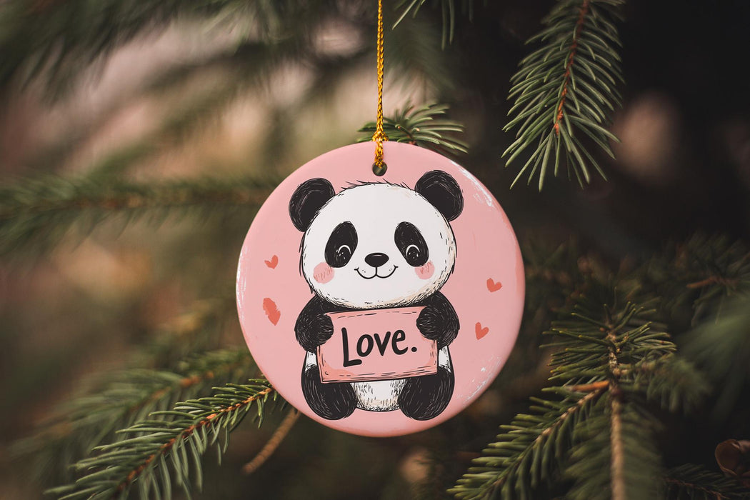 a pink ornament with a panda holding a love sign