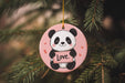 a pink ornament with a panda holding a love sign