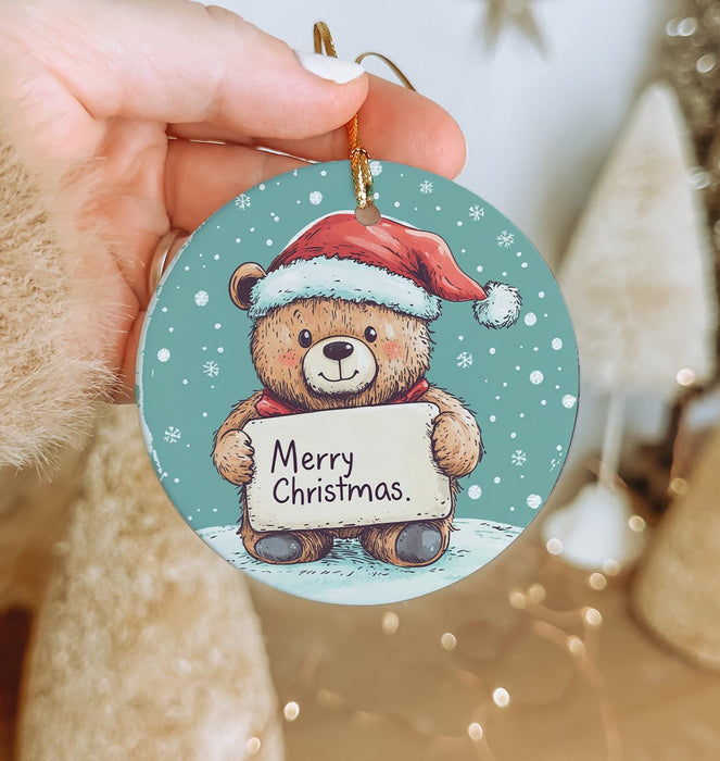 a person holding a christmas ornament in their hand