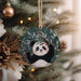 a panda bear ornament hanging from a christmas tree