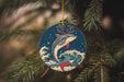 a christmas ornament hanging from a christmas tree