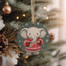 a christmas ornament hanging from a christmas tree
