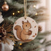 a christmas ornament hanging from a christmas tree