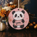 a ceramic ornament with a panda holding a love sign