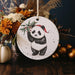 a christmas ornament with a panda bear on it