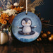a ceramic ornament with a penguin on it