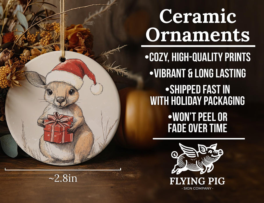 a ceramic ornament with a picture of a kangaroo holding a present