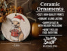 a ceramic ornament with a picture of a kangaroo holding a present