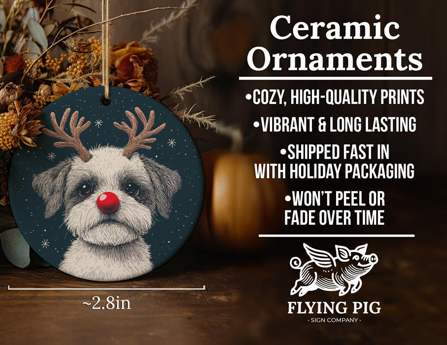 a ceramic ornament with a dog wearing reindeer antlers