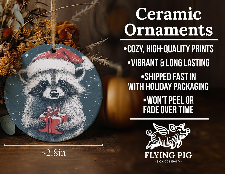 a ceramic ornament with a raccoon holding a present