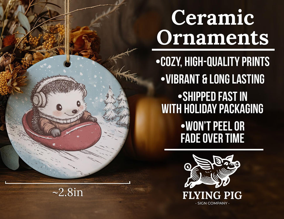 a ceramic ornament with a hedge riding a sled