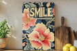 a painting of a flower with the word smile on it