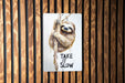 a sticker of a slotty hanging on a wooden wall