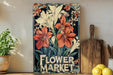 a flower market sign sitting on top of a wooden shelf
