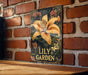 a picture of a lily garden on a brick wall