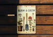 a sign that says bloom and grow on it