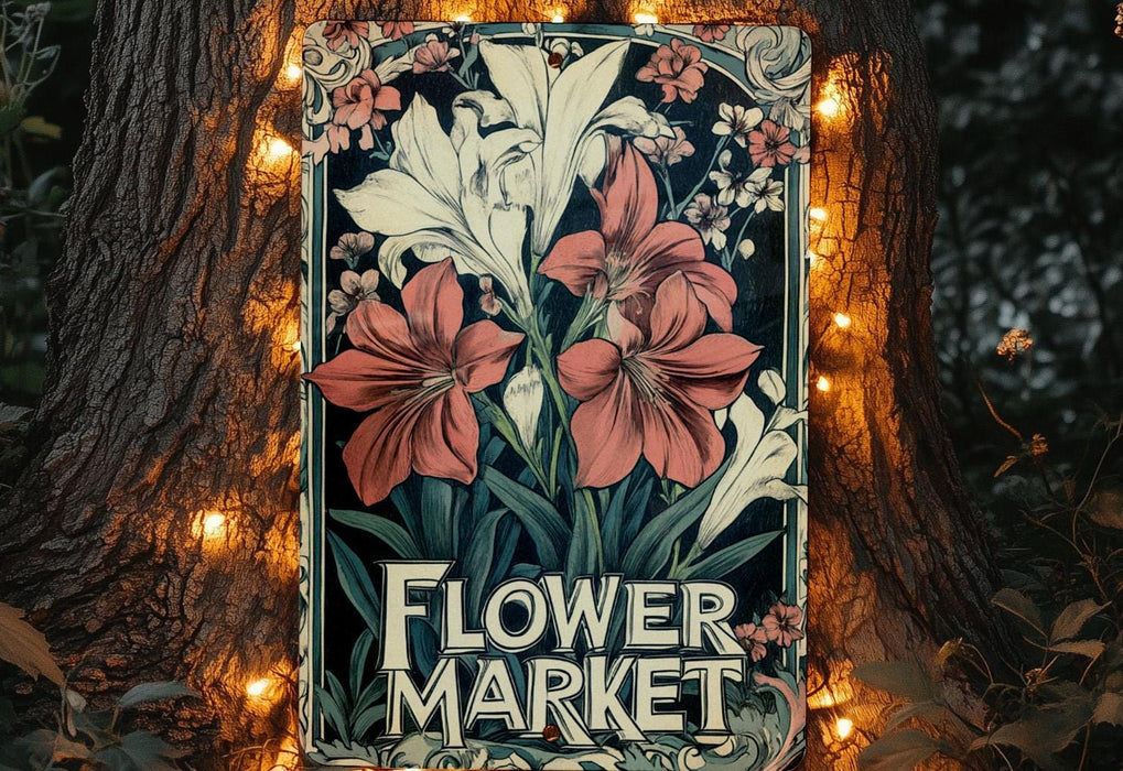 a flower market sign on a tree with lights