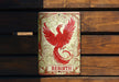 a red bird is sitting on a bench