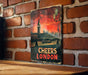 a sign on a brick wall that says cheers london