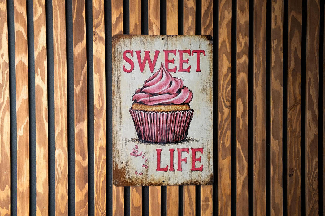 a sign that says sweet life with a cupcake on it