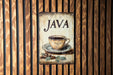 a sign on a wooden wall that says java