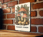a picture of a forest finds sign on a brick wall