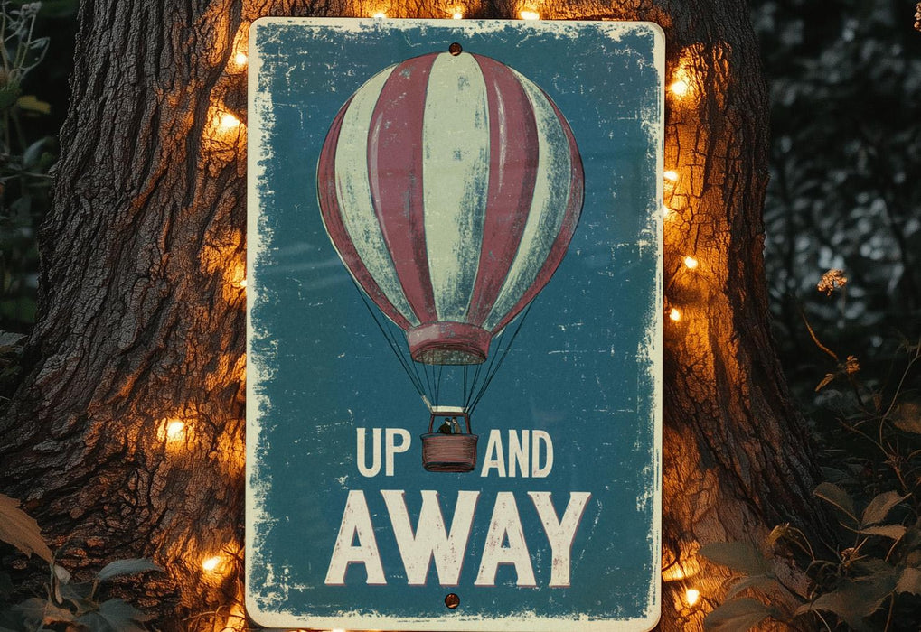 a sign that says up and away with a hot air balloon