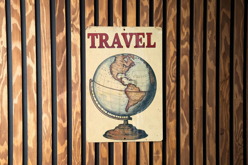 a wooden wall with a sign that says travel on it