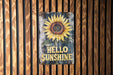 a sign on a wooden wall that says hello sunshine