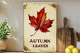 a picture of a leaf on a sign that says autumn leaves