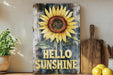 a picture of a sunflower on a shelf