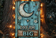 a wooden sign that says dream big next to a tree