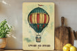 a painting of a hot air balloon on a shelf