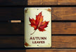 a sign that says autumn leaves on it