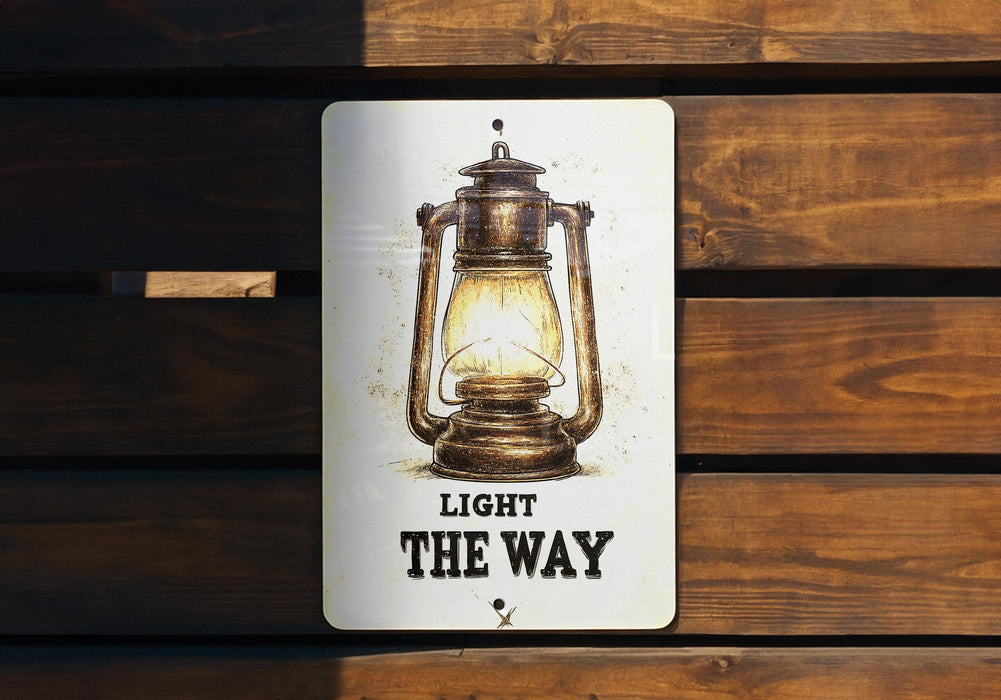 a light the way sign on a wooden wall