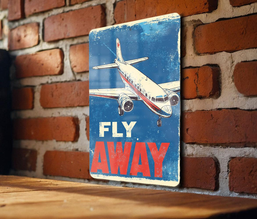 a sign that says fly away on a brick wall