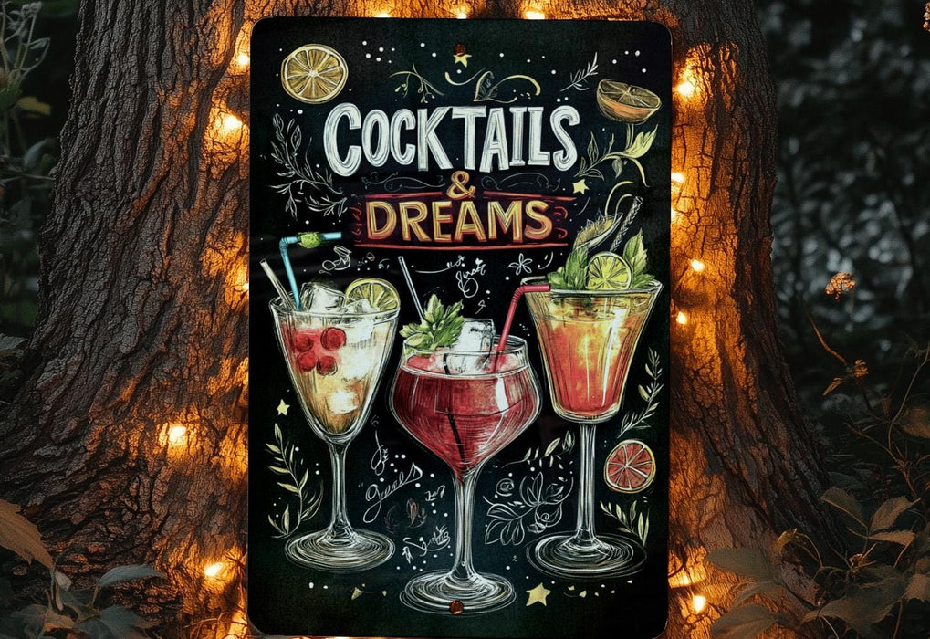 a sign advertising cocktails and dreams in front of a tree