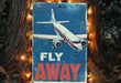 a metal sign with a picture of a plane on it
