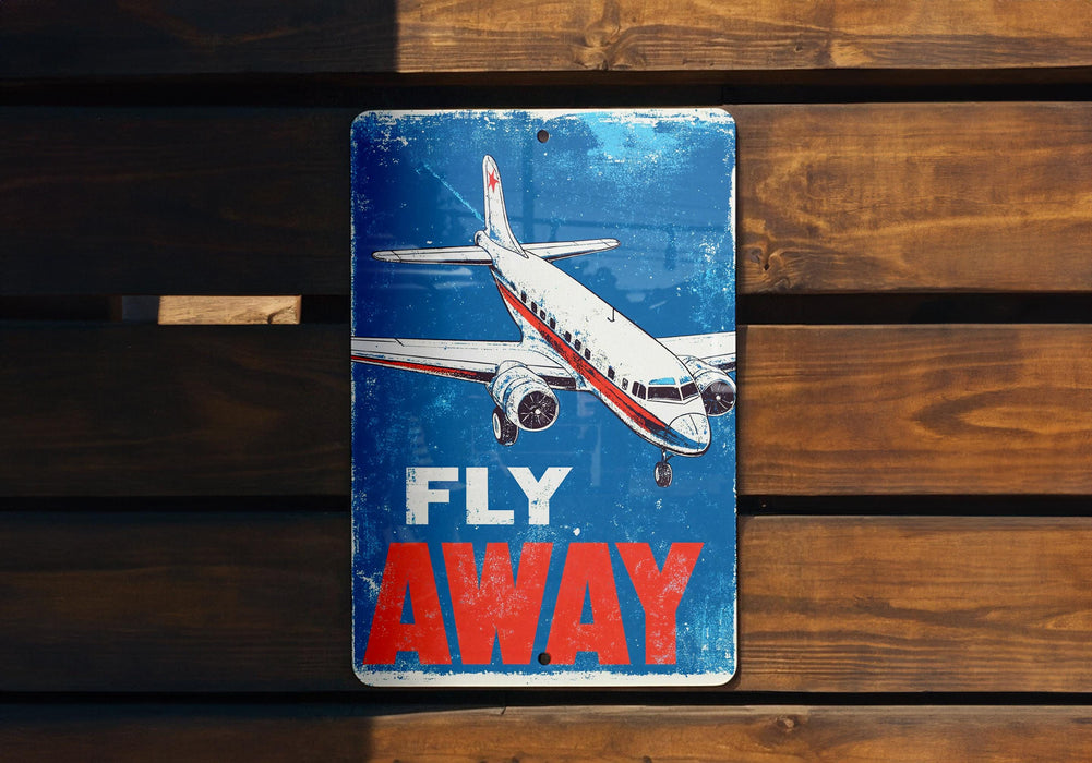 a sign that says fly away on a wooden wall