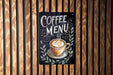 a coffee menu hanging on a wooden wall