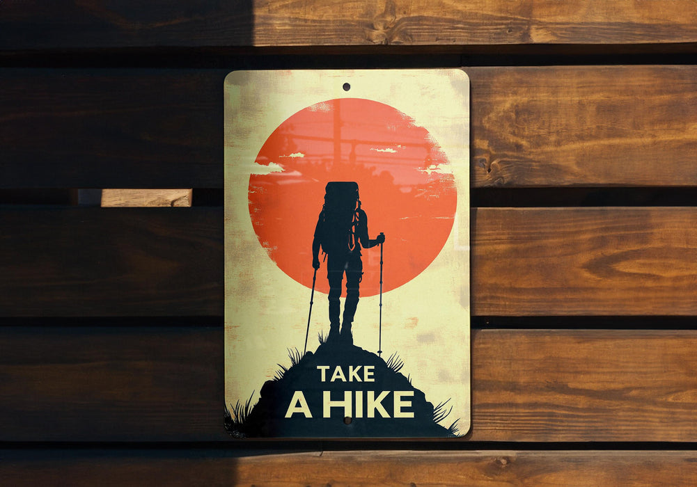 a sign that says take a hike on a wooden bench