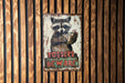 a picture of a raccoon holding a cup of coffee