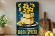 a yellow cake with yellow flowers on top of it