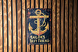 a sailor's best friend sign on a wooden wall
