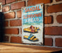 a sign on a brick wall that says sandal slowdown ahead