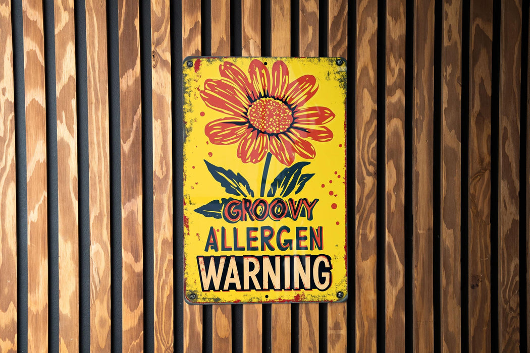 a yellow sign with a flower on it on a wooden wall